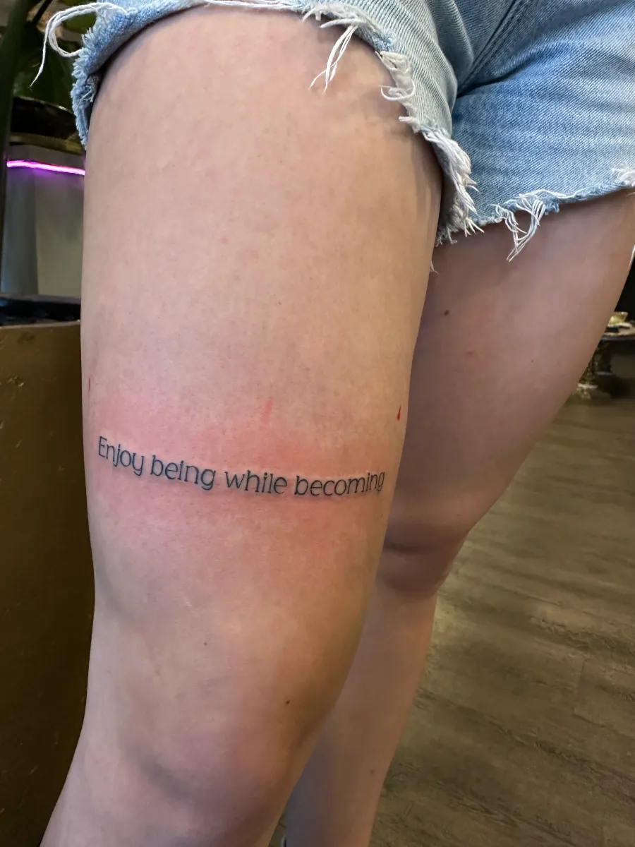 Fine line band tattoo wrapping the thigh, Phantom Avenue Edmonton