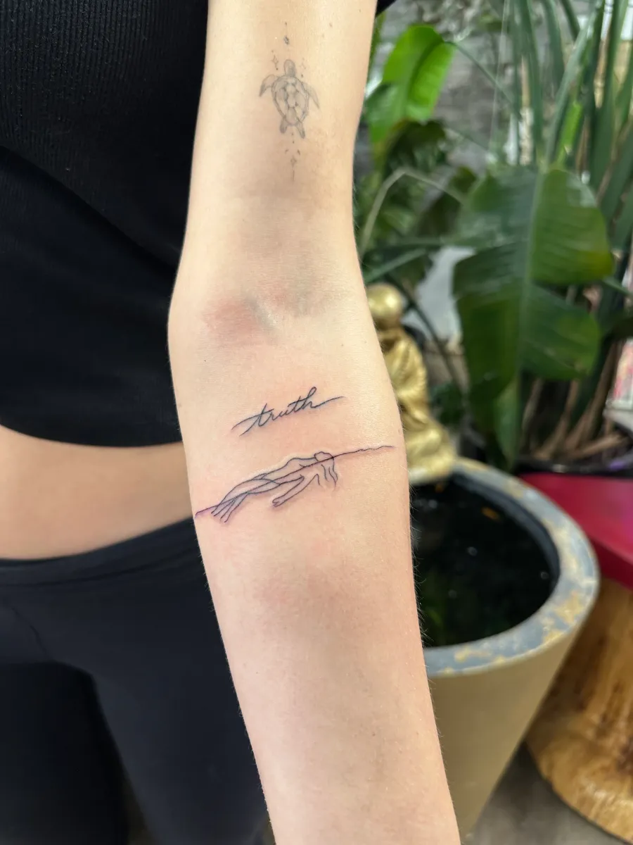 Small fine line tattoo on the inner forearm, Phantom Avenue Edmonton