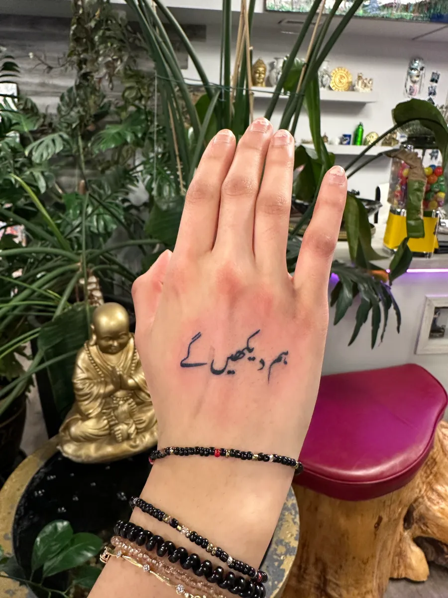 Fine line script tattoo on the side of the hand, Phantom Avenue Edmonton