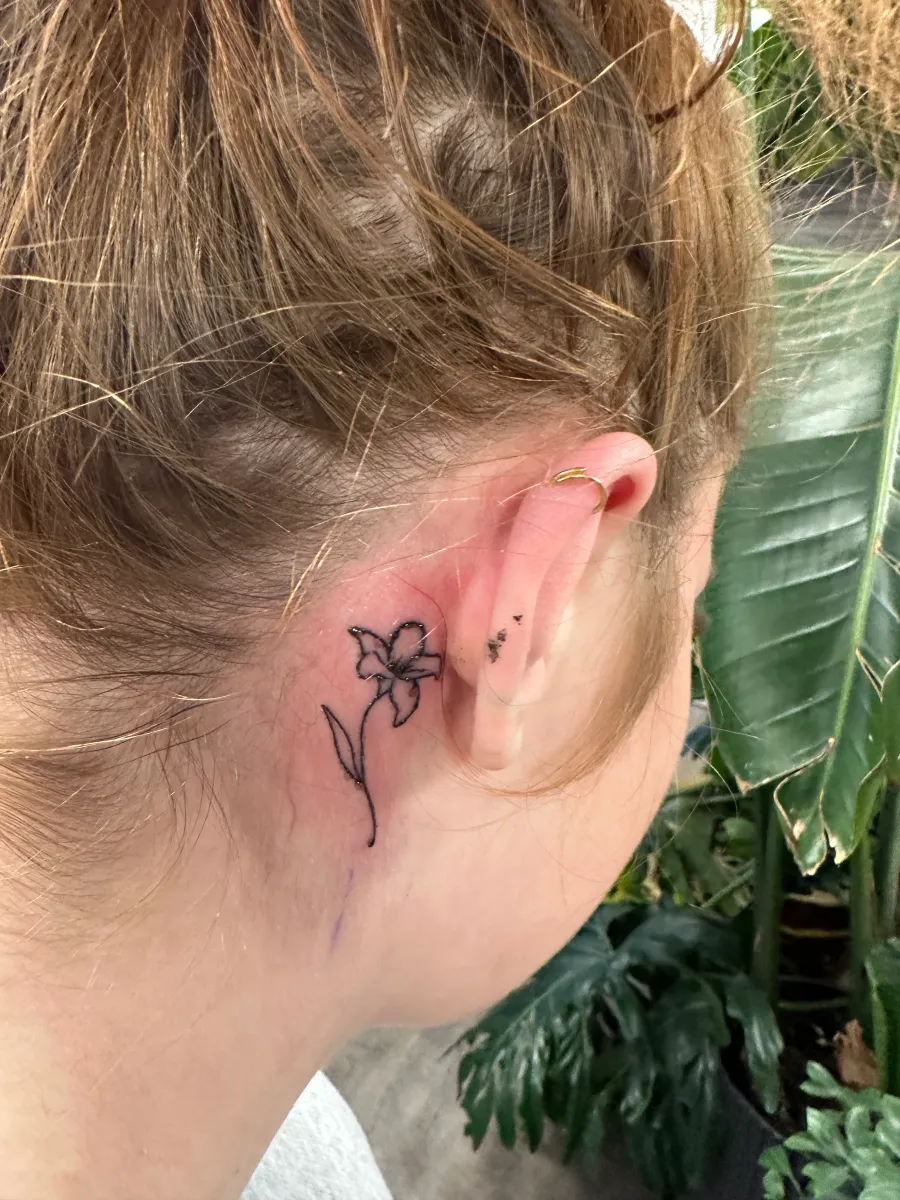 Small fine line tattoo behind the ear, Phantom Avenue Edmonton