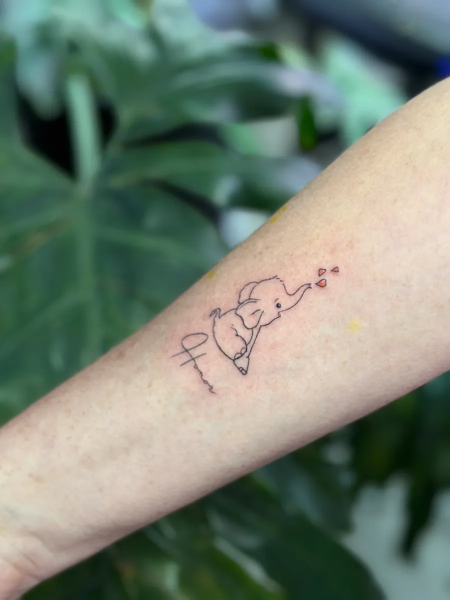 Fine line cursive lettering tattoo on the inner forearm, Phantom Avenue Edmonton