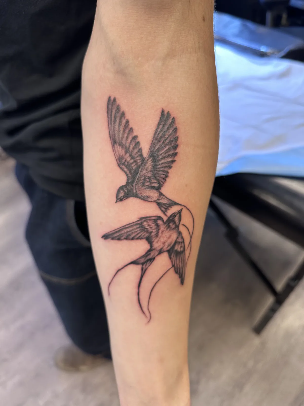 Hummingbird and floral tattoo on the upper arm, Phantom Avenue Edmonton
