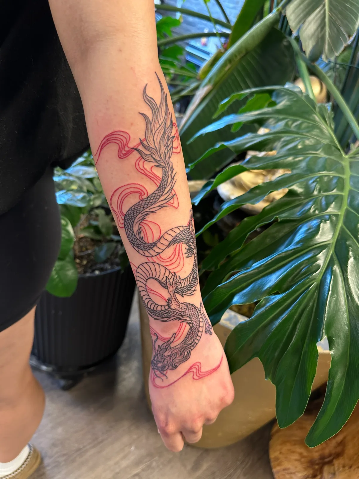 Colour floral tattoo on the forearm, Phantom Avenue Edmonton