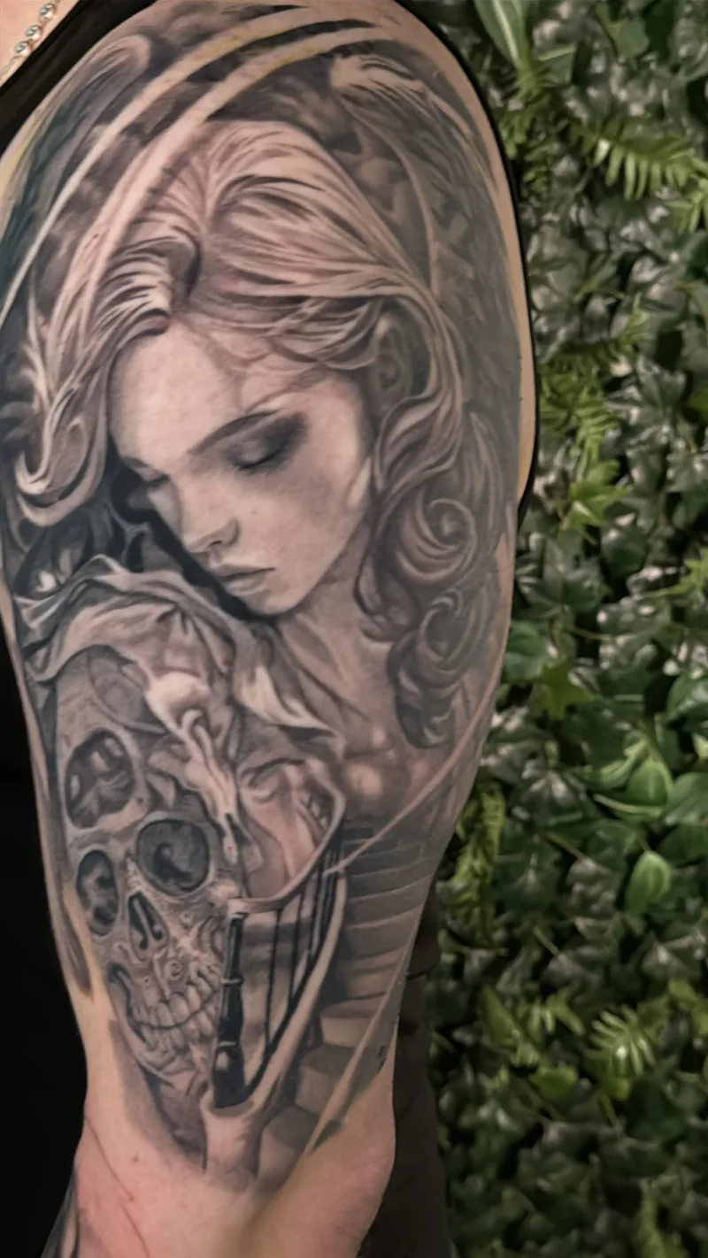 Layered large-scale black and grey tattoo by Juan Del Pino at Phantom Avenue, Edmonton