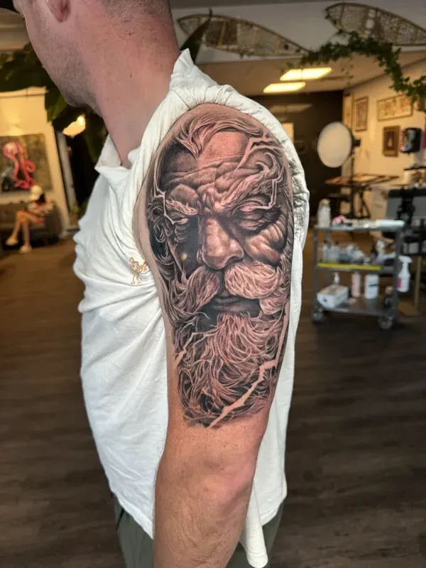 Atmospheric large-scale black and grey tattoo by Juan Del Pino at Phantom Avenue, Edmonton