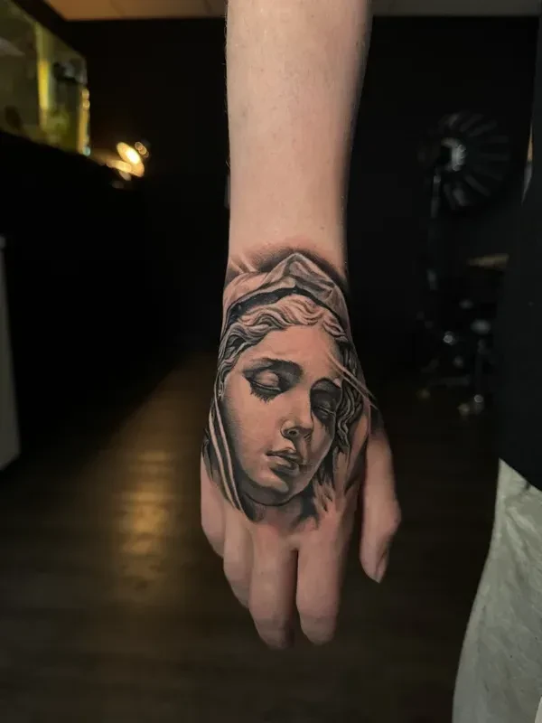 Detailed compact black and grey tattoo by Juan Del Pino at Phantom Avenue, Edmonton