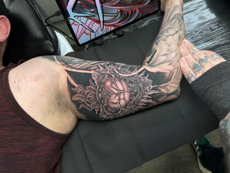 Smoky black and grey tattoo by Juan Del Pino at Phantom Avenue, Edmonton