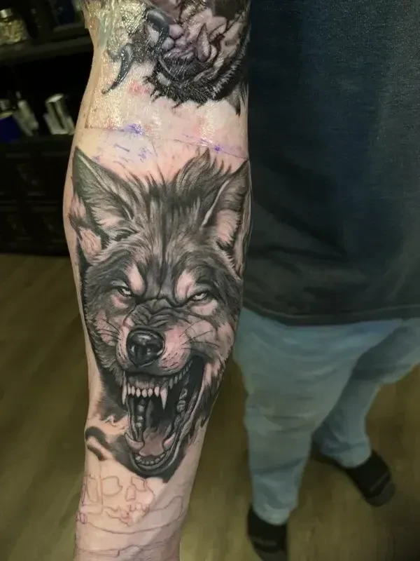 High-contrast black and grey tattoo by Juan Del Pino at Phantom Avenue, Edmonton