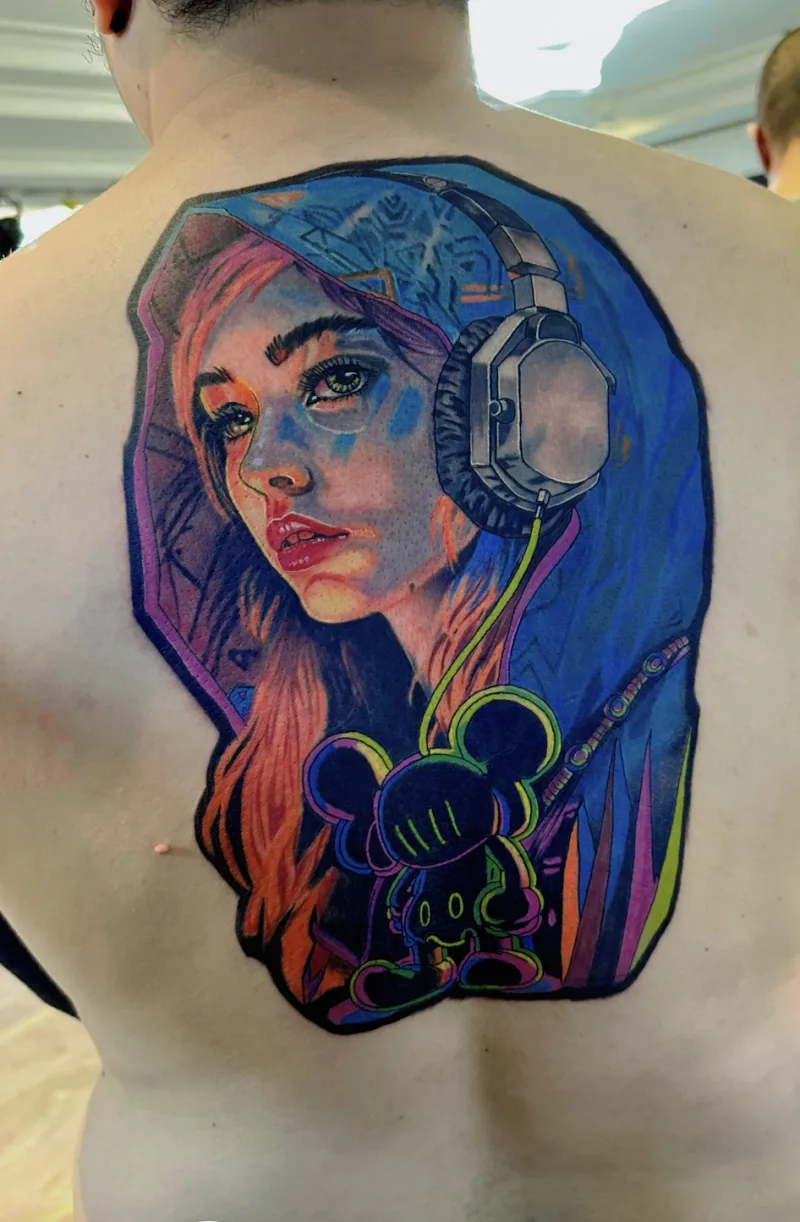 Bold-palette colour tattoo by Michael Gumatay at Phantom Avenue, Edmonton